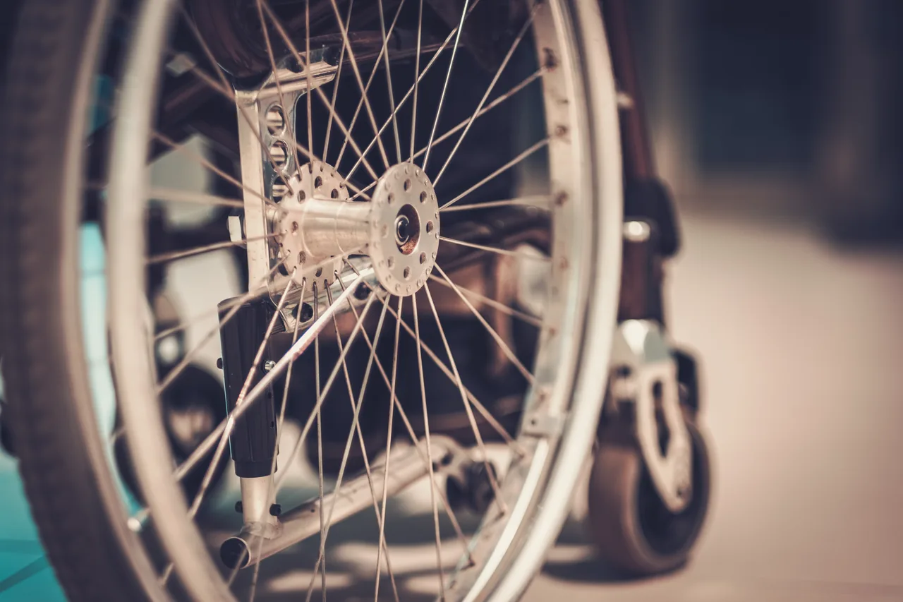 Close-up detail of a wheelchair wheel and spokes